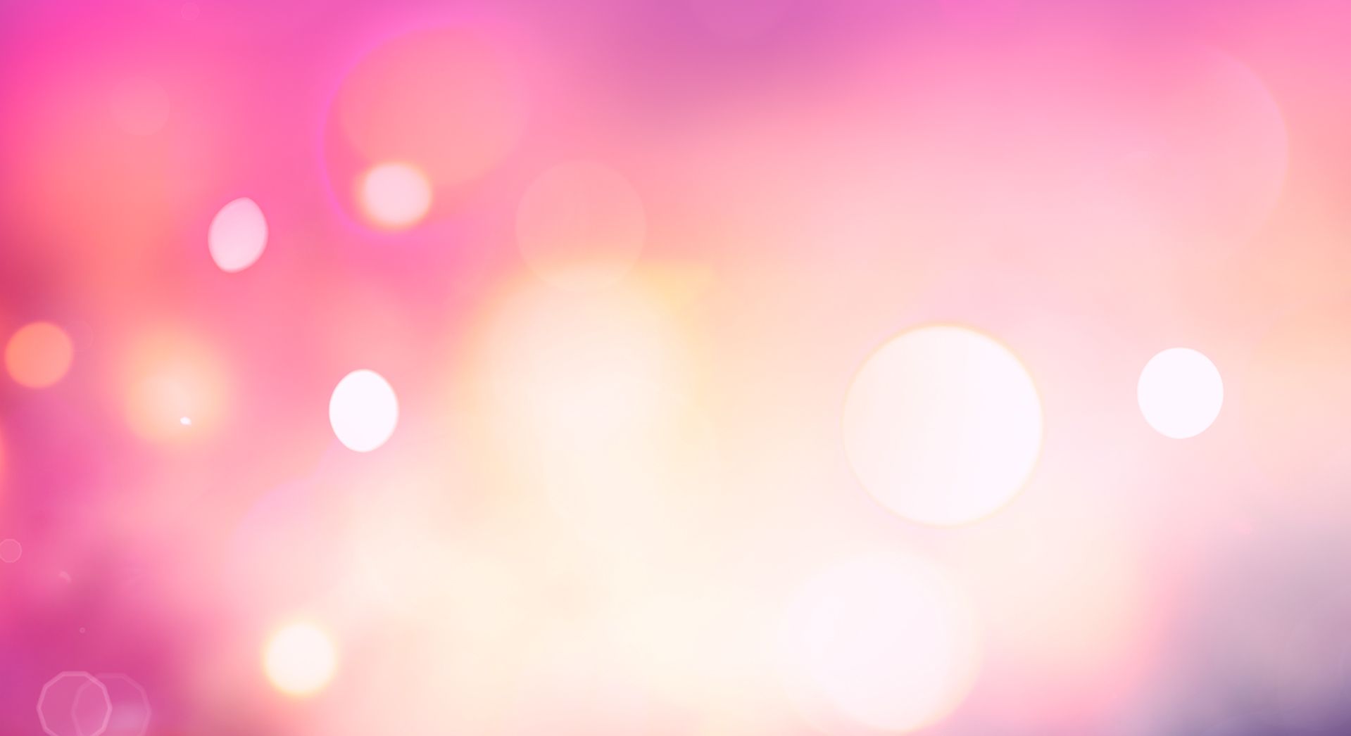 Verschwommener, pinker Hintergrund mit gelben und weißen Lichtflecken